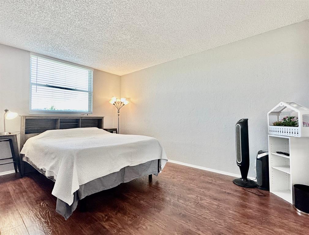 5301 Northwest 2nd Avenue, Unit 408 Boca Raton, FL 33487 - Photo 21 of 32 a bedroom with a bed and a window