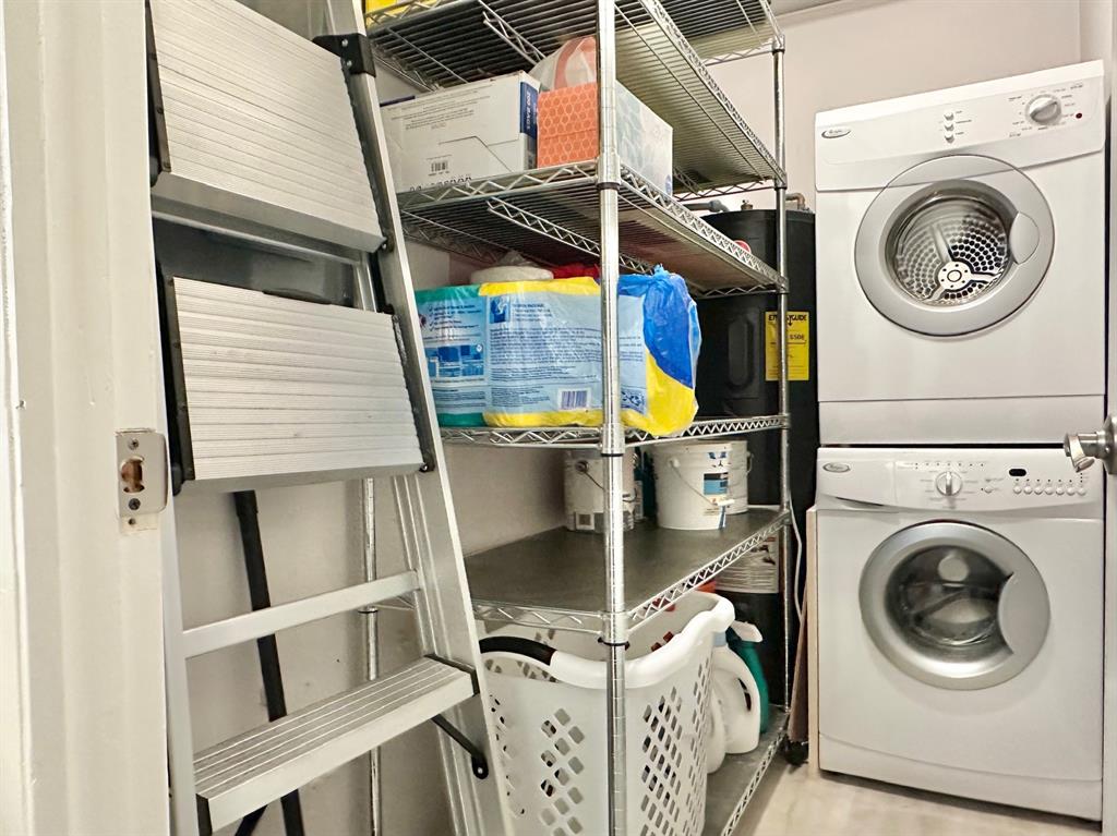 5301 Northwest 2nd Avenue, Unit 408 Boca Raton, FL 33487 - Photo 27 of 32 a utility room with dryer and washer