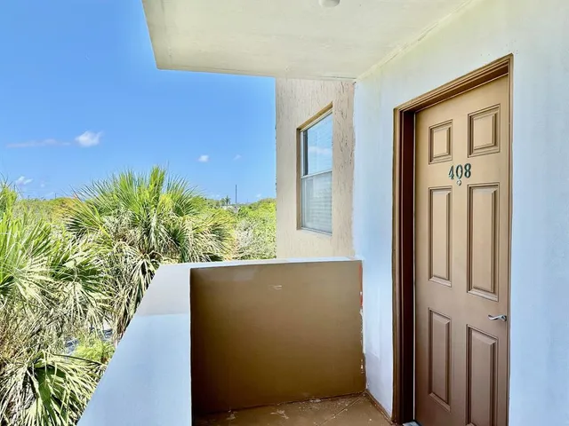 a spacious bathroom with a shower and a mirror