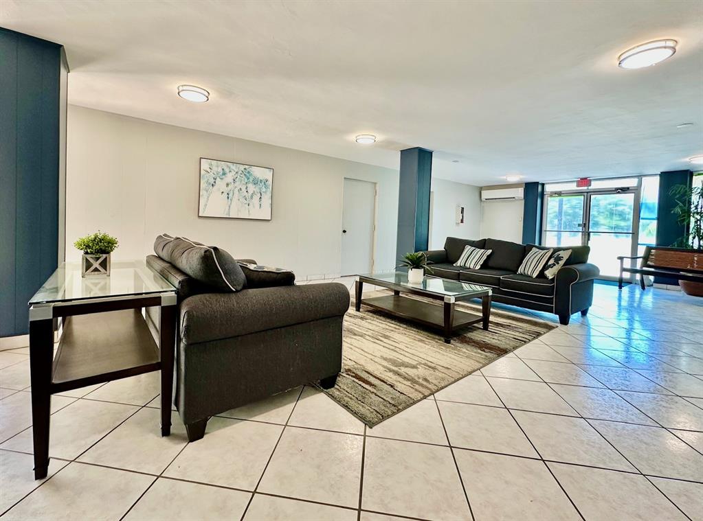 5301 Northwest 2nd Avenue, Unit 408 Boca Raton, FL 33487 - Photo 30 of 32 a living room with furniture