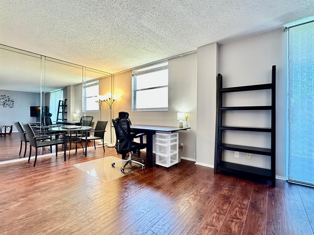 5301 Northwest 2nd Avenue, Unit 408 Boca Raton, FL 33487 - Photo 8 of 32 a living room with furniture and wooden floor