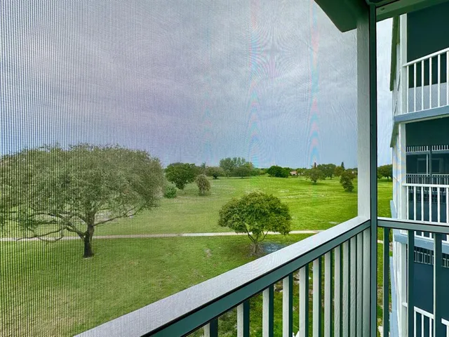 a view of a garden from a balcony