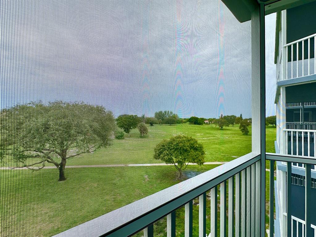 5301 Northwest 2nd Avenue, Unit 408 Boca Raton, FL 33487 - Photo 9 of 32 a view of a garden from a balcony