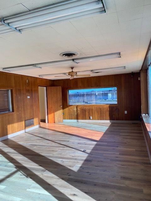 925 Short Spring Street Shreveport, LA 71101 - Photo 3 of 7 a room with wooden floor and furniture