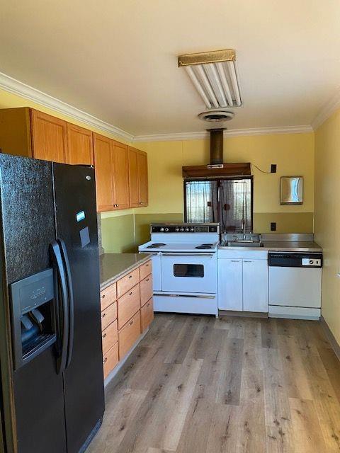 925 Short Spring Street Shreveport, LA 71101 - Photo 5 of 7 a kitchen with granite countertop a sink stainless steel appliances and cabinets