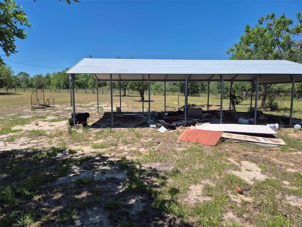 11651 Northeast 73rd Lane Bronson, FL 32621 - Photo 3 of 39 a view of a swimming pool with a patio