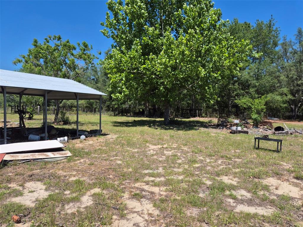 11651 Northeast 73rd Lane Bronson, FL 32621 - Photo 4 of 39 a view of outdoor space with seating