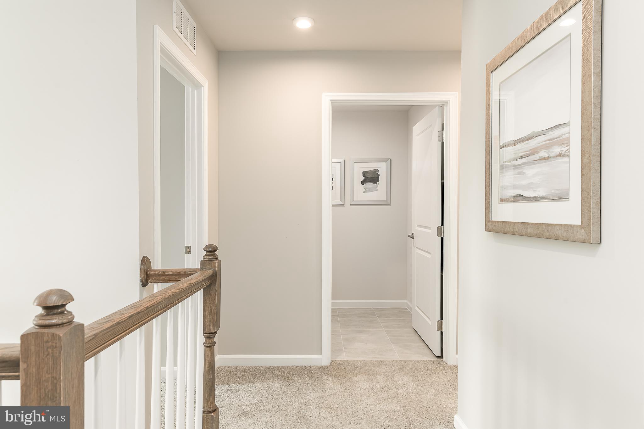 1058 Wallace Way Ranson, WV 25438 - Photo 13 of 23 a view of a hallway with windows