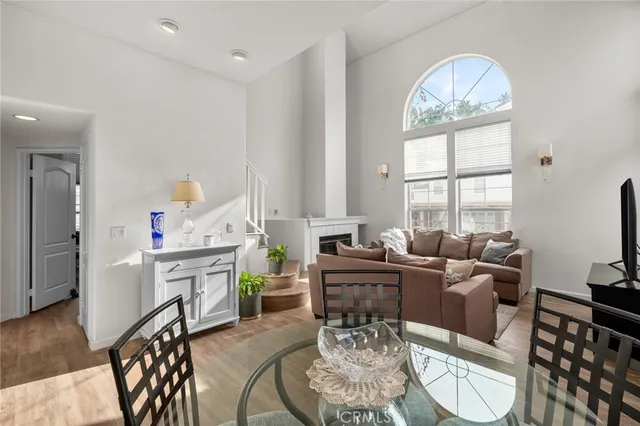 a living room with furniture a fireplace and a table