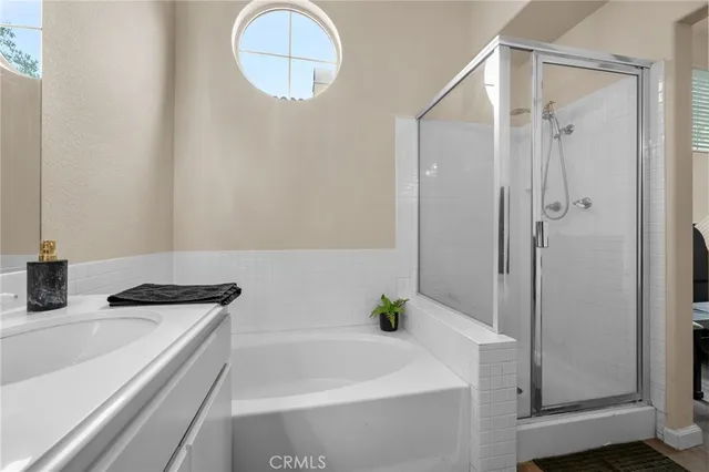 a bathroom with a tub and a sink