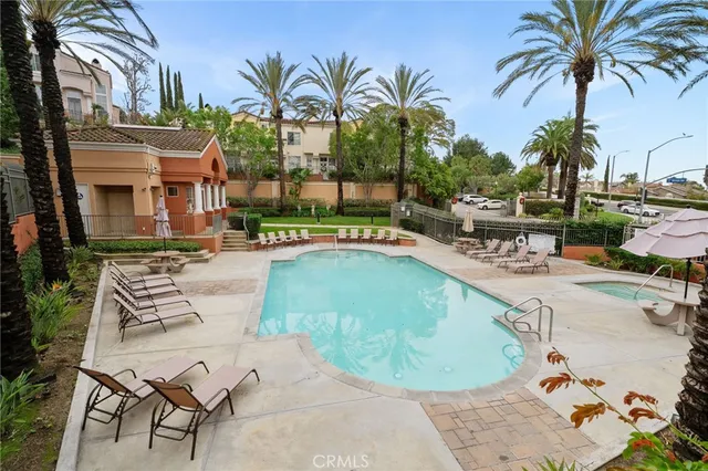 a view of a swimming pool with chairs