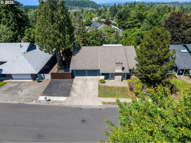 an aerial view of a house with yard swimming pool and outdoor seating