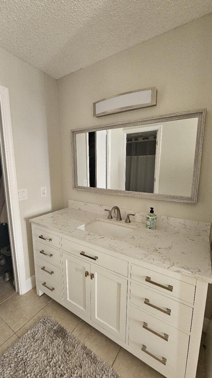 4 Royal Palm Way, Unit 6050 Boca Raton, FL 33432 - Photo 23 of 35 a bathroom with a sink and a mirror