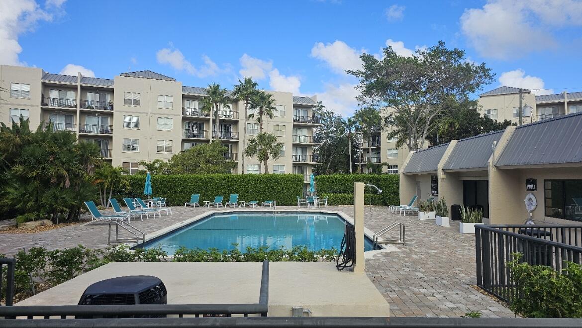 4 Royal Palm Way, Unit 6050 Boca Raton, FL 33432 - Photo 32 of 35 a front view of a house with a yard