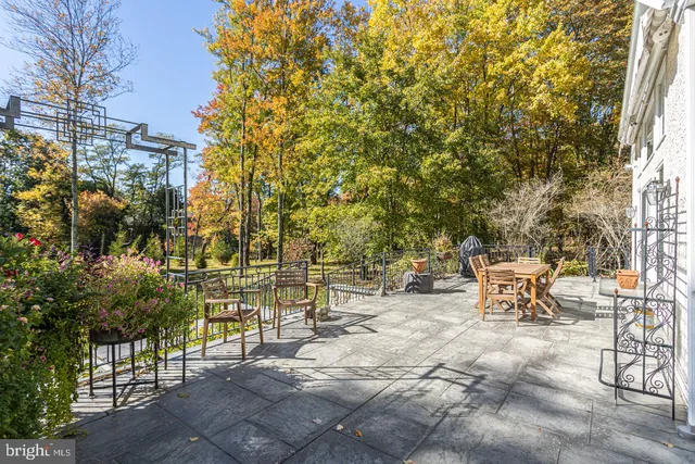 a living room with furniture a window and a fireplace