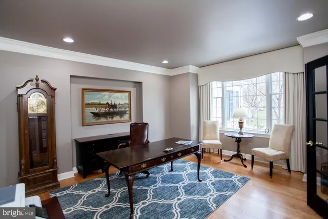a large kitchen with stainless steel appliances kitchen island granite countertop a sink and cabinets