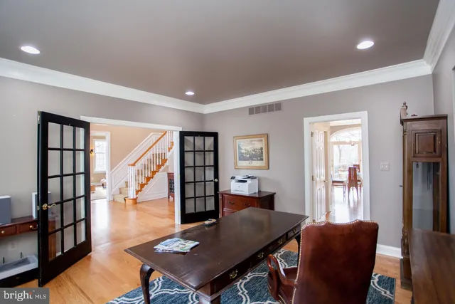 a kitchen with stainless steel appliances kitchen island granite countertop a stove and a refrigerator