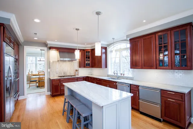 a living room with furniture a ceiling fan and a rug