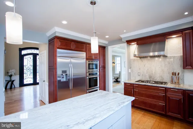 a bathroom with a double vanity sink and mirror with shower
