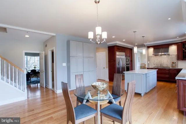 a bed room with a bed and a chandelier