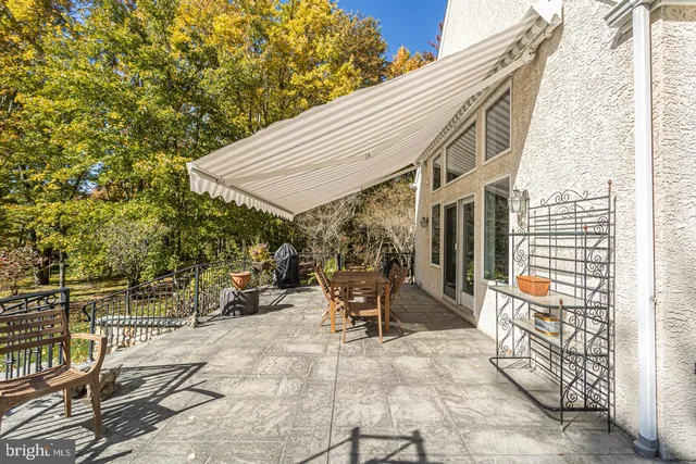 a living room with furniture fireplace and window