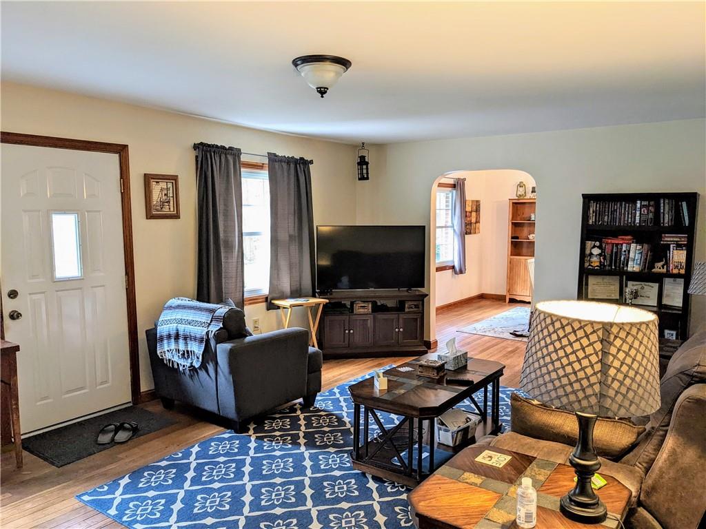 455 Old Plank Road Butler, PA 16002 - Photo 7 of 25 a living room with furniture a rug and a flat screen tv