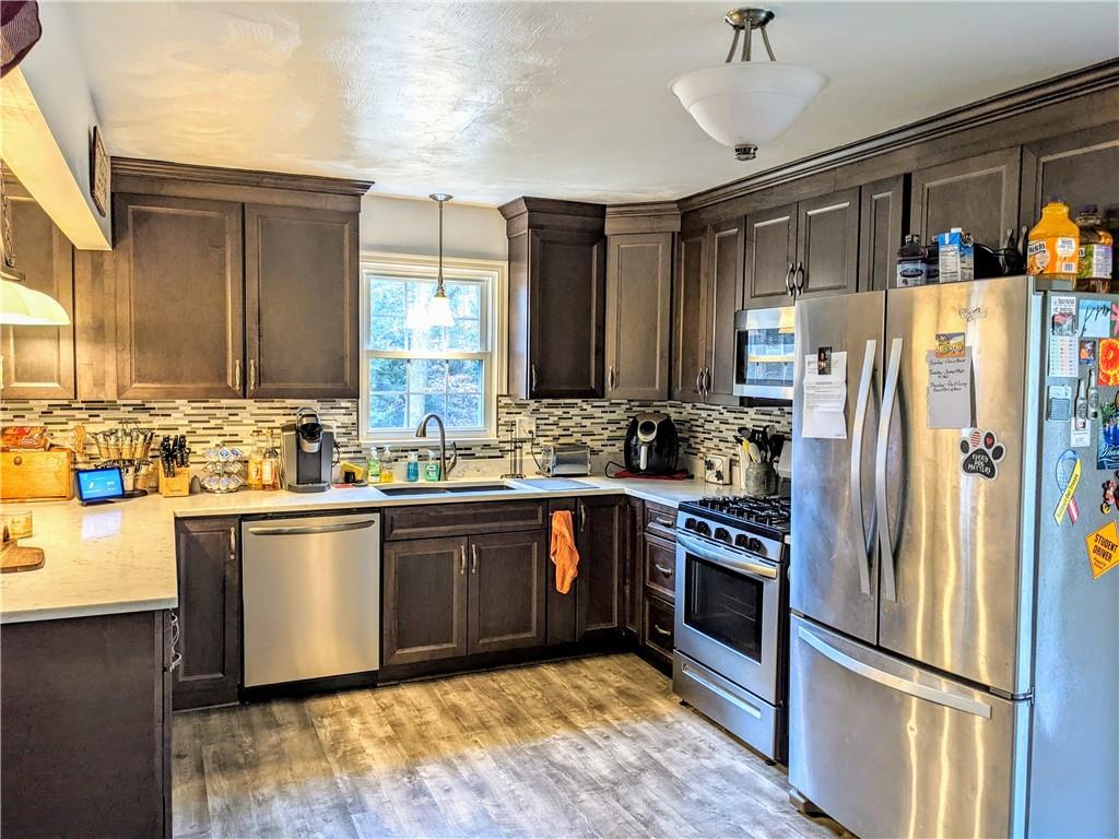 455 Old Plank Road Butler, PA 16002 - Photo 9 of 25 a kitchen with stainless steel appliances granite countertop a refrigerator a sink and dishwasher