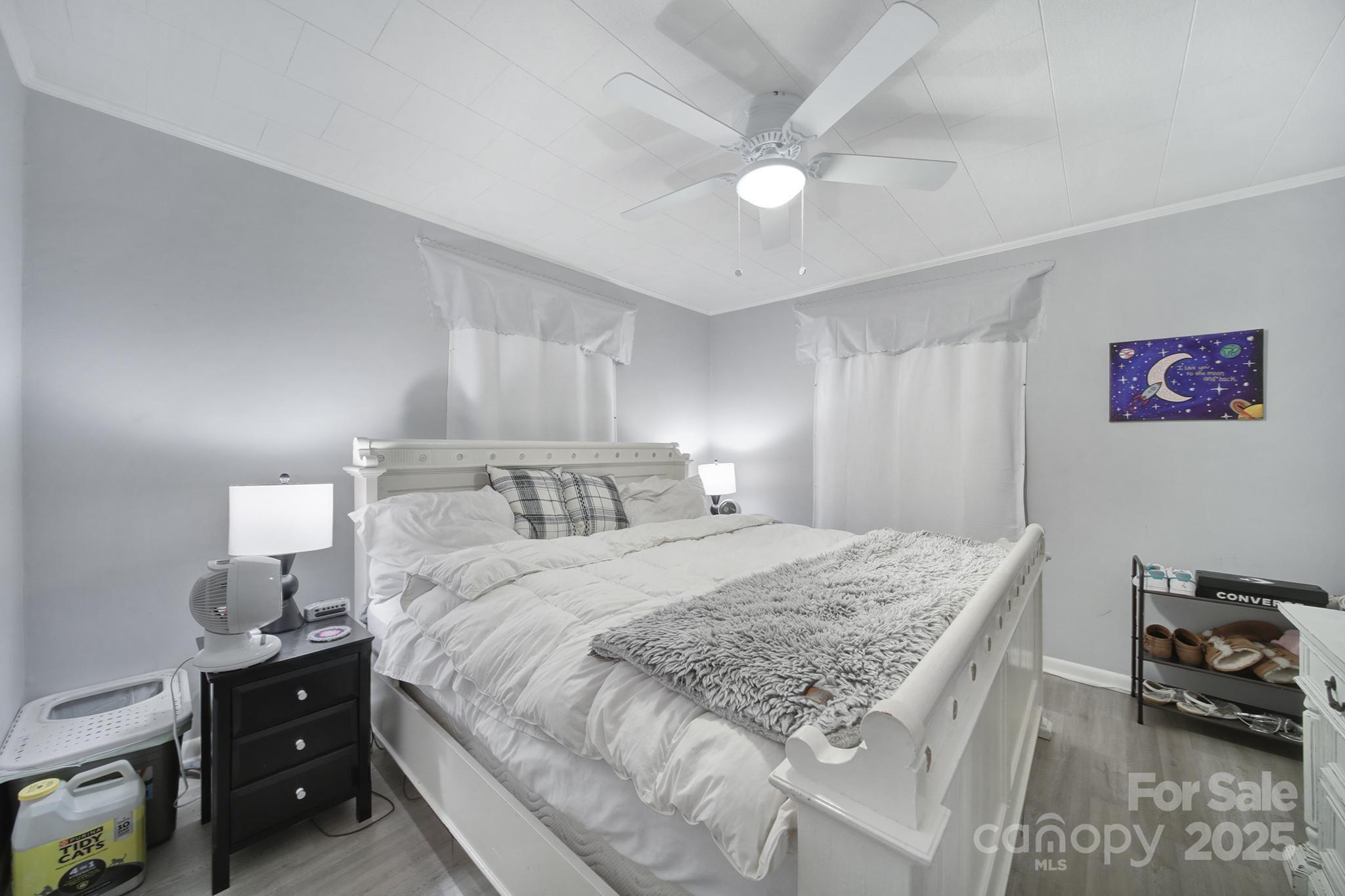 1306 Church Street Lancaster, SC 29720 - Photo 14 of 26 a bedroom with a bed and a lamp on dresser