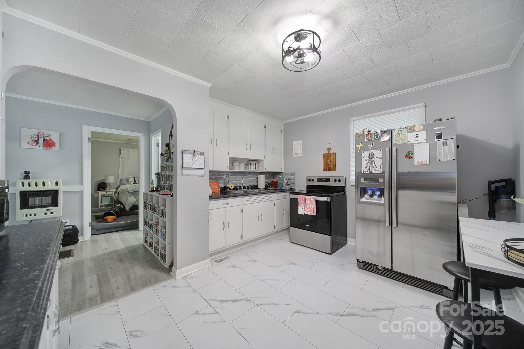 1306 Church Street Lancaster, SC 29720 - Photo 17 of 26 a kitchen with a refrigerator and microwave