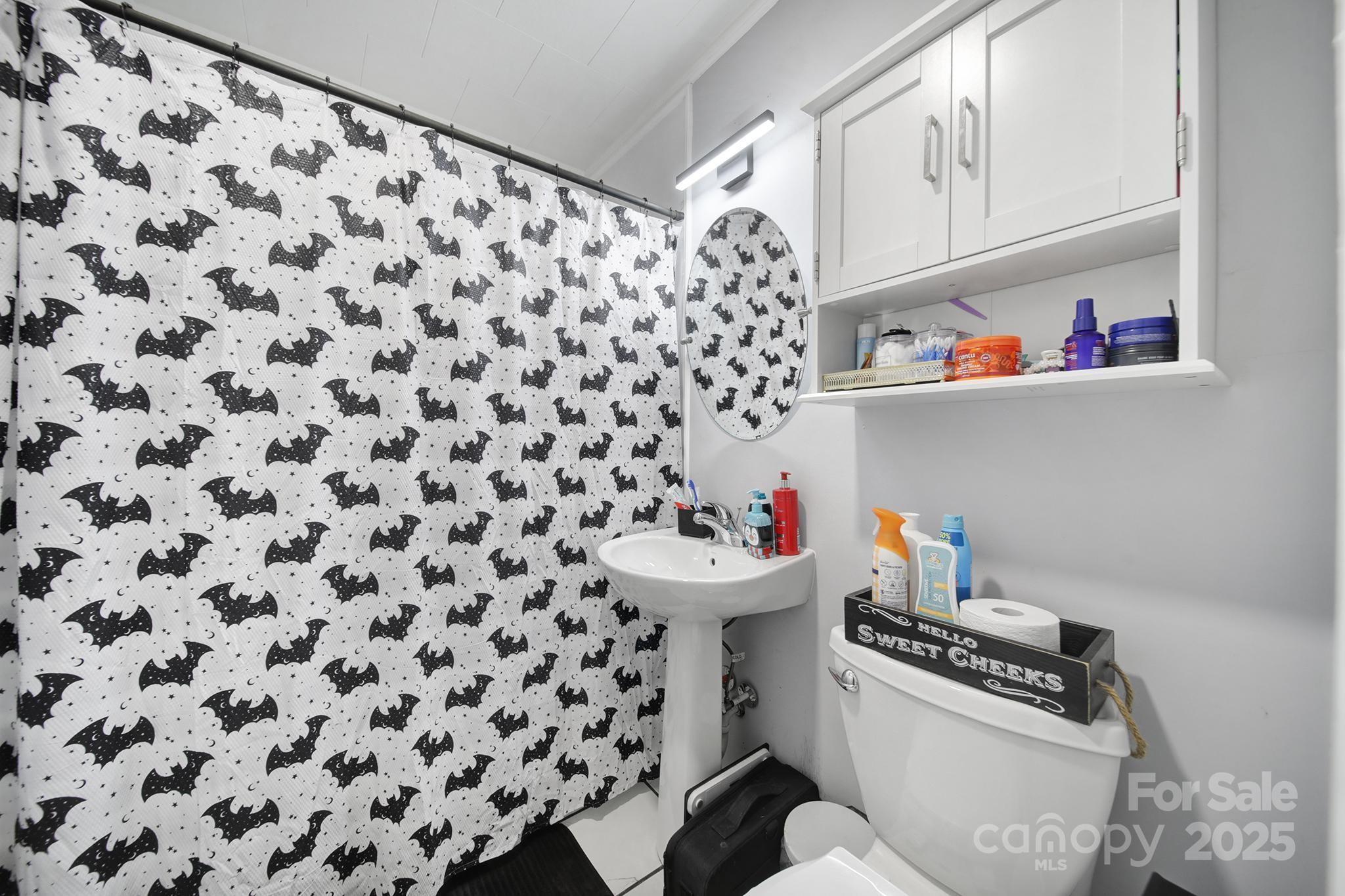 1306 Church Street Lancaster, SC 29720 - Photo 18 of 26 a bathroom with a sink toilet and a shower