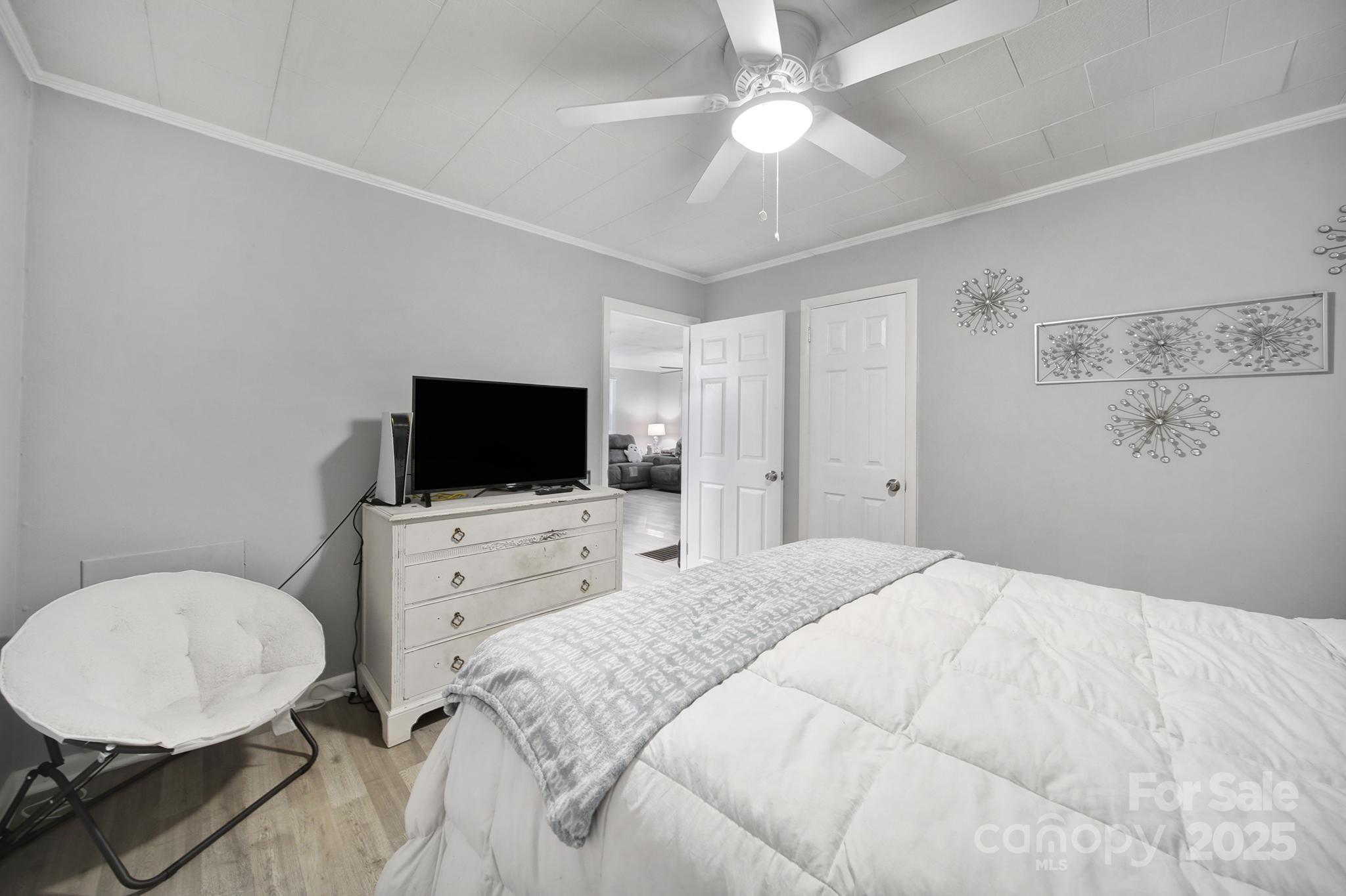 1306 Church Street Lancaster, SC 29720 - Photo 20 of 26 a bedroom with a bed and a flat screen tv