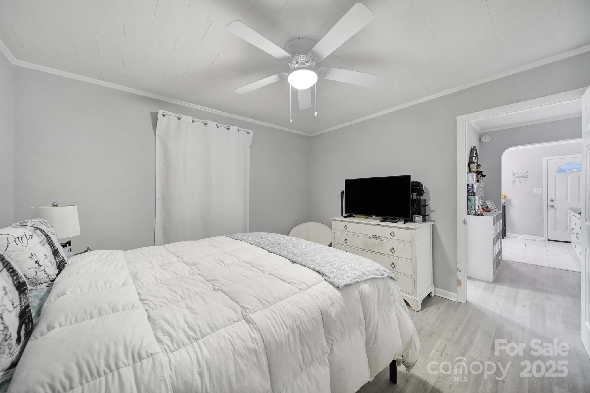 1306 Church Street Lancaster, SC 29720 - Photo 21 of 26 a bedroom with a bed and a flat screen tv