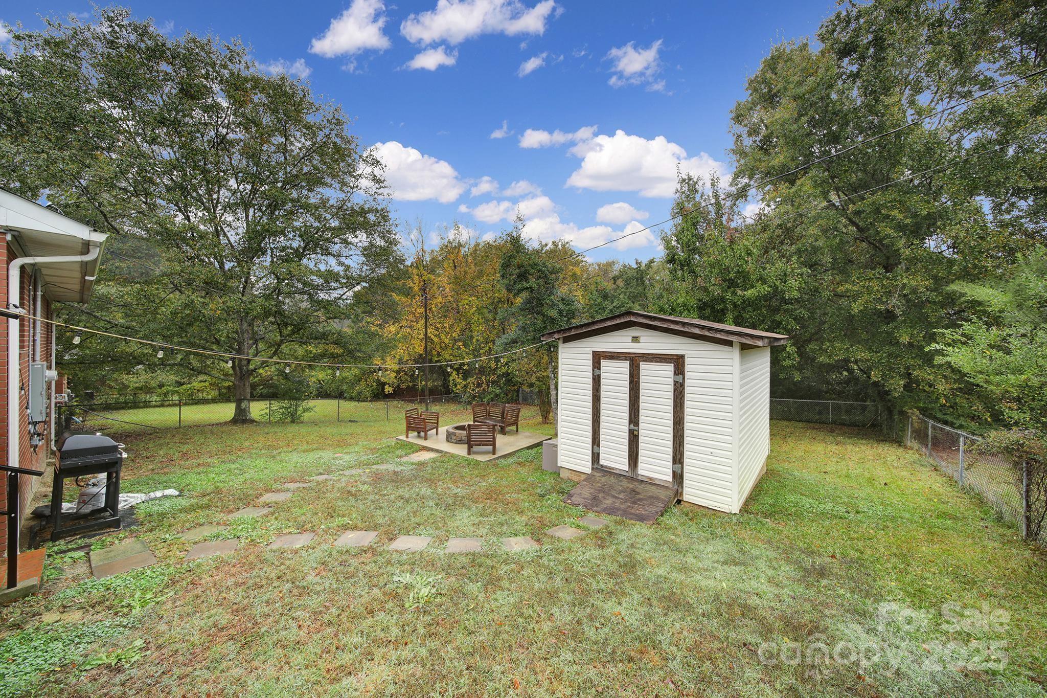 1306 Church Street Lancaster, SC 29720 - Photo 23 of 26 a backyard of a house with lots of green space
