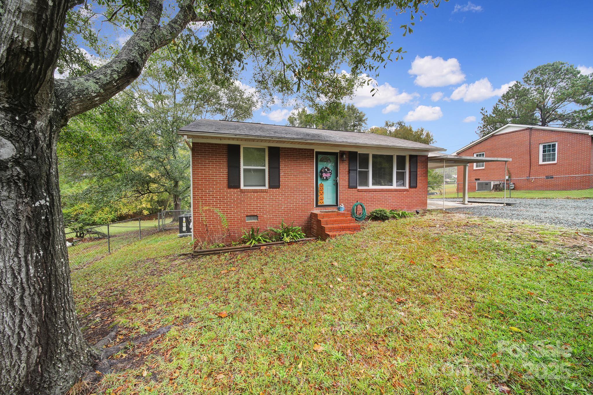 1306 Church Street Lancaster, SC 29720 - Photo 4 of 26 a front view of a house with garden