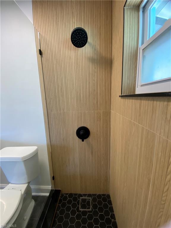 740 108th Avenue North Naples, FL 34108 - Photo 15 of 26 a bathroom with a sink toilet and shower