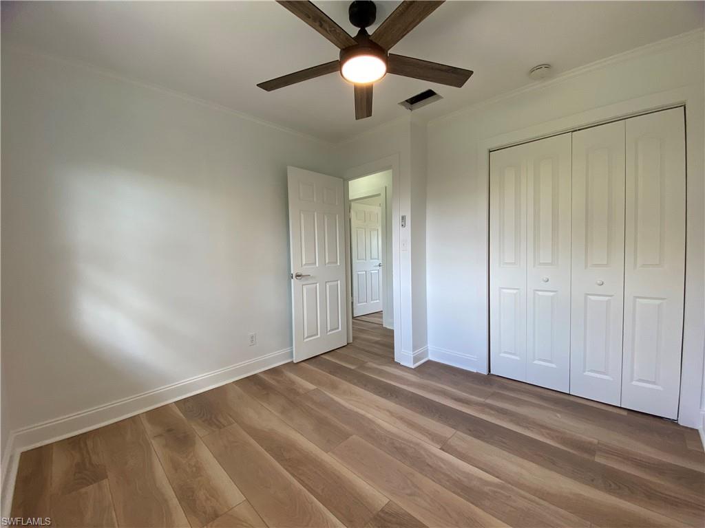 740 108th Avenue North Naples, FL 34108 - Photo 19 of 26 wooden floor in an empty room