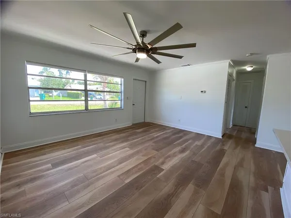 a view of an empty room with a window