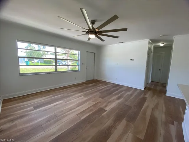 a view of an empty room with a window