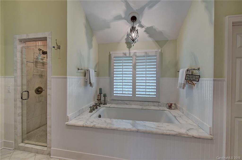 859 Museum Drive Charlotte, NC 28207 - Photo 15 of 23 a bathroom with a granite countertop sink and shower