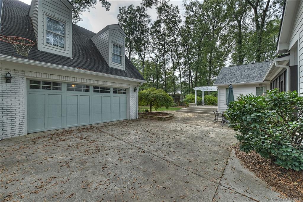 859 Museum Drive Charlotte, NC 28207 - Photo 20 of 23 a view of a house with a yard and garage