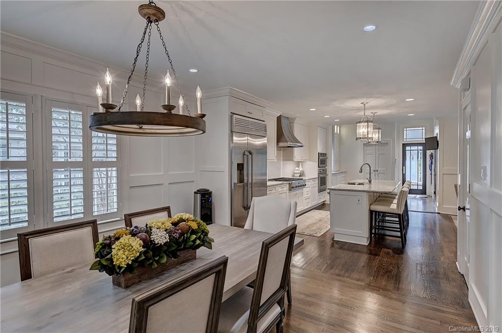 859 Museum Drive Charlotte, NC 28207 - Photo 6 of 23 a dining room with furniture and kitchen view