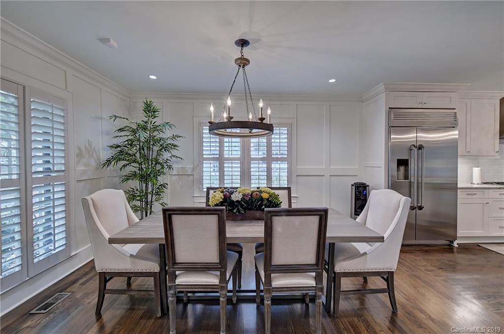 859 Museum Drive Charlotte, NC 28207 - Photo 7 of 23 a dining room with furniture window and wooden floor