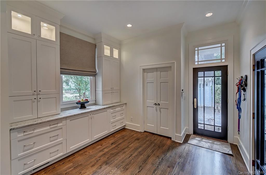 859 Museum Drive Charlotte, NC 28207 - Photo 10 of 23 a view of a kitchen with wooden floor and electronic appliances