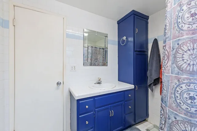 a kitchen with stainless steel appliances granite countertop a refrigerator stove microwave and sink