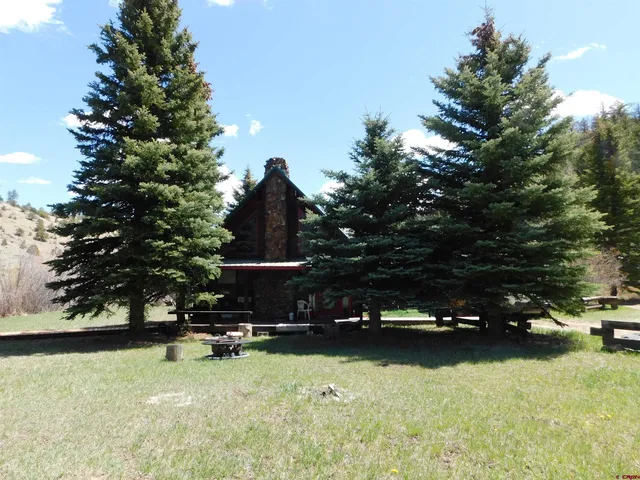 a view of swimming pool with chairs