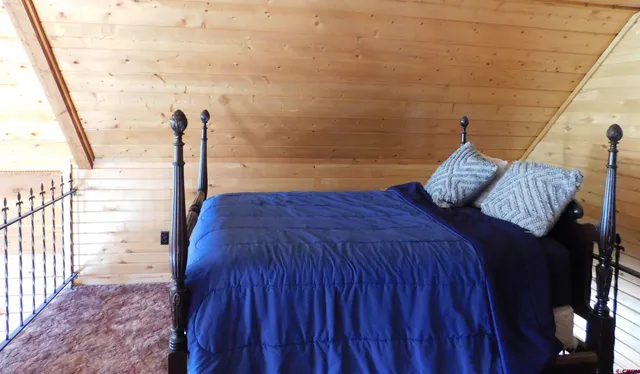 a bedroom with a bed and a cabinets