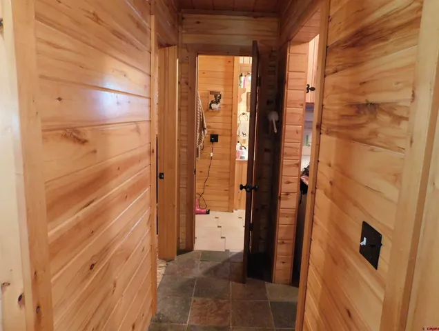 a kitchen with stainless steel appliances granite countertop a sink and a refrigerator