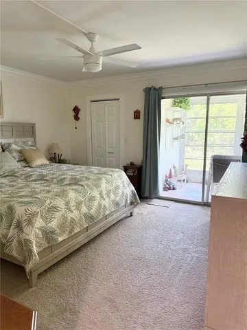 a bedroom with a large bed and a large window