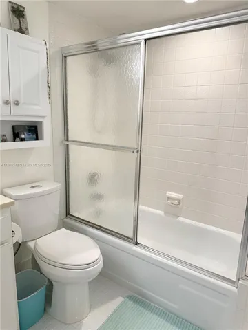 a view of walk in closet with clothes