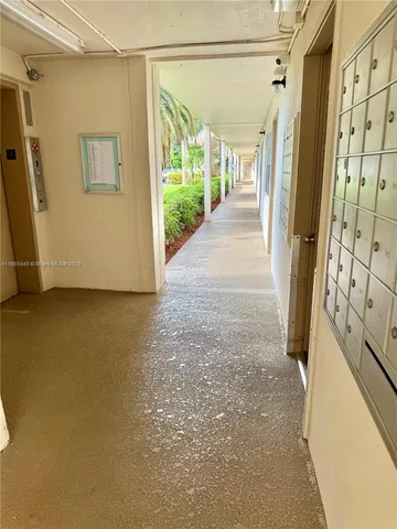 a view of a house with swimming pool and sitting area